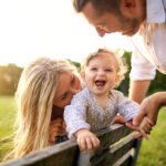 Happy family in a park in summer autumn